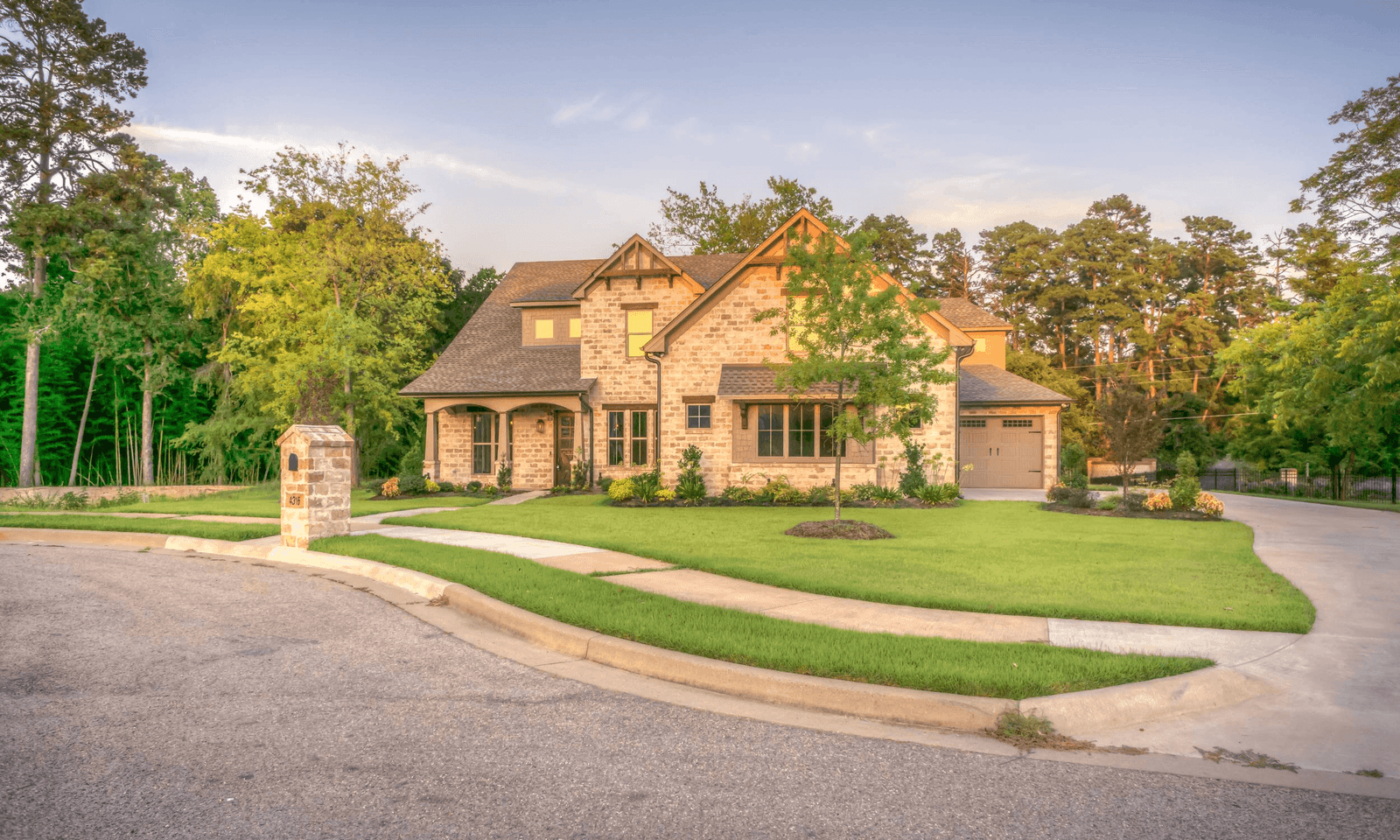 Stone home with new roof at dusk in Toronto